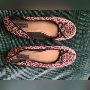 Worn only a few times, leopard flats, trimmed with patent material and bow